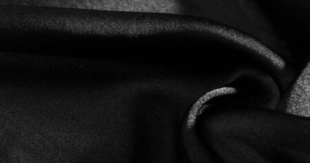 Background, pattern, texture, wallpaper, black silk fabric.  Add a touch of luxury to any design, putting it in this ultra-soft and very lightweight polyester lining fabric.の写真素材