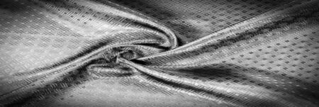 Background texture, pattern. Black silk fabric with a small checkered pattern. You do not need smoke and mirrors, this Katia smoky gray checkered SILK yarn speaks for itself. creates airy fabricの写真素材