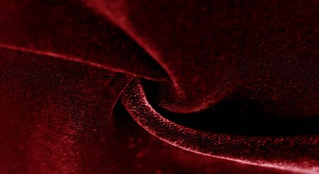 Texture background, pattern. red velveteen. Rock the runway with this beautiful high fashion fabric. This medium weight fabric has a beautiful shine with a velvet face for a feeling of luxury.の写真素材