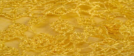 Texture, background, pattern, postcard, silk fabric, female yellow scarf with lace wrappers. Use...