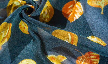 Silk fabric, blue with a print of autumn leaves of yellow color. The photo is intended for,...