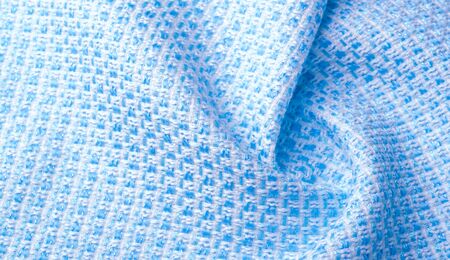Texture, fabric, pattern. Large weave of blue and white threads, tightly woven fabric with a very...