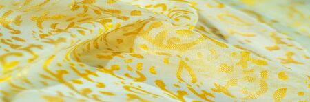 Texture, pattern, collection, silk fabric, female scarf, golden pastel on a beige background,...