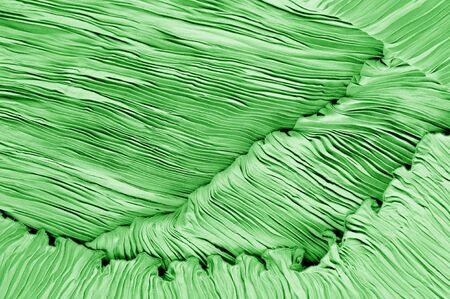 Texture, background, pattern, Fabric silk pleated green. This beautiful quality fabric has an excellent corrugated wrinkled texture, drape and semi-curved. Ideal for making your designの写真素材
