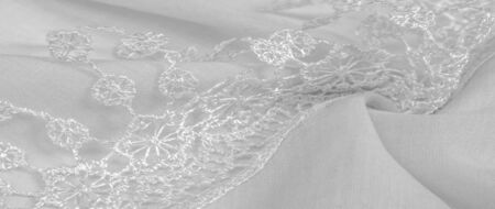 Texture, background, pattern, postcard, silk fabric, female white scarf with lace wrappers. Use these fancy images to create your print and digital materials.の写真素材