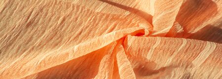 texture, background, pattern, collection, wrinkled silk fabric champagne (pale fawn). 3D pleated, wrinkled and crinkled light camel color pure silk fabricの写真素材
