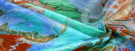 texture, background, pattern, wallpaper, postcard, poster, silk fabric with a painted artist's palette, bright colors, colors, unrestrained imagination - this is what you need for your  projectsの写真素材