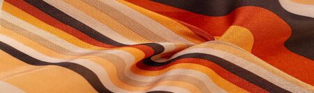 Silk fabric, striped fabric, brownish yellow red beige lines, exquisite design. The photo is...