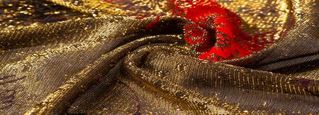 texture, background, pattern, lace with gold sequins Elastic lace pattern from gold strings with...
