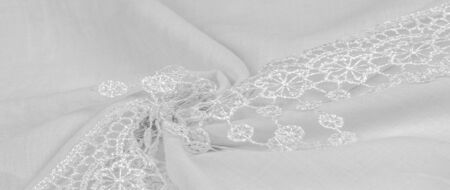 Texture, background, pattern, postcard, silk fabric, female white scarf with lace wrappers. Use...