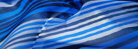 Background texture. multicolored striped silk fabric. Mexican coloring theme bright colored striped...