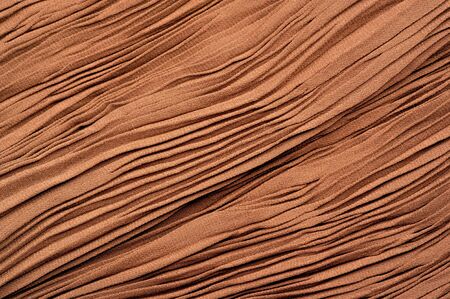 Texture, background, pattern, Fabric gofre brown. Apricot color. Gofre and pleated. the design makes the projects luxurious and fashionable. This fabric can be used vertices, DIY projects and so on.の写真素材