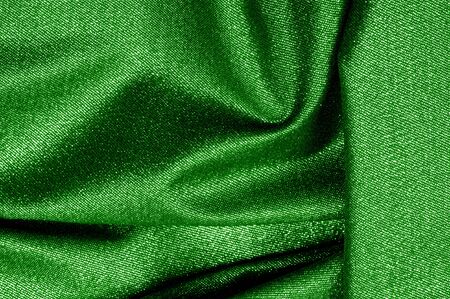 Texture, background, pattern. The fabric is Dark green coated with a metallic silver thread. These fabrics are ideal for any project, wallpaper, all design solutions. and many uses of shipsの写真素材