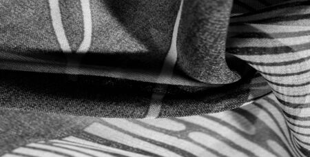texture, background, pattern, wallpaper. Black white silk fabric pattern. This medium-weight rayon fabric has a nice shine with slight color variations. Perfect for adding elegance to your designs.の写真素材