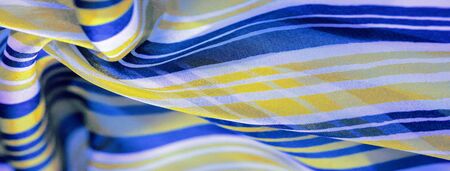 Background texture. multicolored striped silk fabric. Mexican coloring theme bright colored striped...