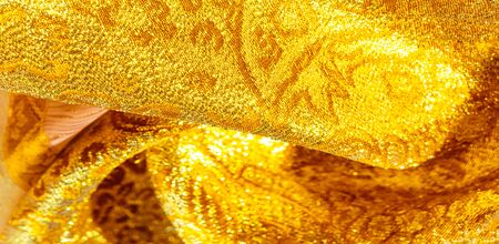 Texture background, pattern. fabric; yellow gold brocade. Organza brocade fabric - shepherd, with a...