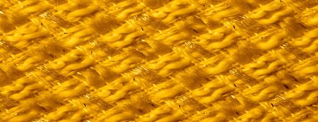 Background texture, pattern. Yellow fabric with metallic sequins. This beautiful lightweight sequined fabric has notes, sequined accents and a beautiful design. It also has a nice sheen.の写真素材