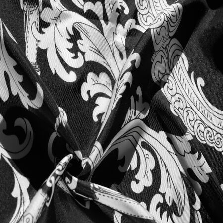 texture, background, black silk fabric with a monogram pattern Exquisite pattern of filigree fabric your design will delight you for a long timeの写真素材