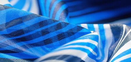 Background texture. multicolored striped silk fabric. Mexican coloring theme bright colored striped pattern with abstract stripesの写真素材