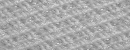 Background texture, pattern. White fabric with metallic sequins, Swivel heads with this two-tone reversible mermaid with sequins. It has a shiny silver top. Ideal for glamorous designs, much more.の写真素材