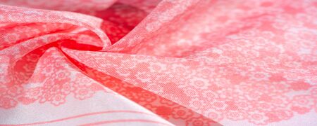 Texture, background, pattern, pink silk fabric on a white background, small flowers pattern...