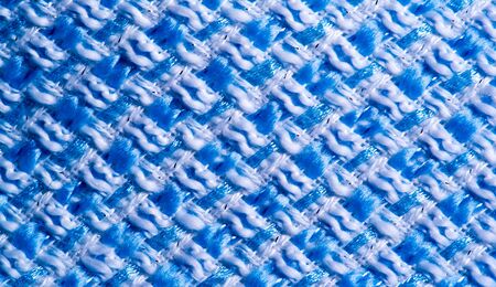 Texture, fabric, pattern. Large weave of blue and white threads, tightly woven fabric with a very...