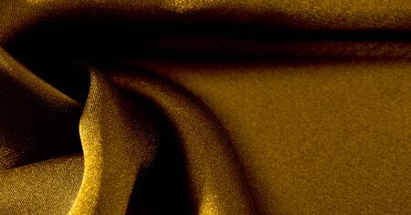 Background, pattern, texture, wallpaper, yellow silk fabric. Add a touch of luxury to any design by adding it to this ultra-soft and very lightweight polyester lining fabric.の写真素材