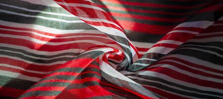 Background texture. multicolored striped silk fabric. Mexican coloring theme bright colored striped...