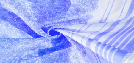 Texture, pattern, blue silk fabric on a white background, flowers pattern silhouette on white background decorative course, postcard wallpaper design. Your project will be successful. Act inspiredの写真素材