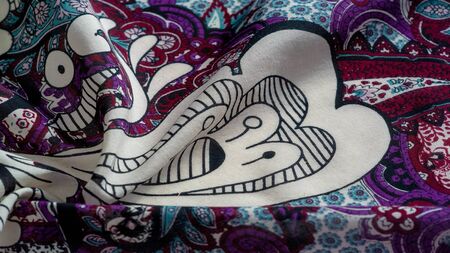 Background texture. cotton women scarf black and white pattern on one side of the scarf and color...