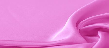 texture. Pink silk fabric. brilliant luster and characteristic small blinds that run horizontally throughout the fabric It falls into soft folds when draped and is the most versatile fabric we carryの写真素材