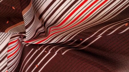 Texture, pattern, collection, silk fabric, brown background with a striped pattern of white and red lines, the Spanish theme, which is great for the design of procedures and projects.の写真素材