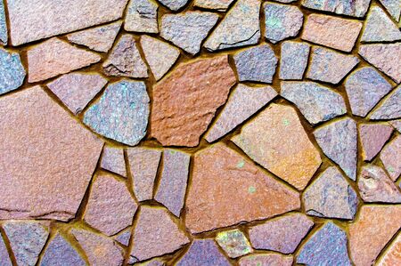 Texture background pattern. Granite stone, sandstone. finishing of buildings fences,  sedimentary rock, consisting of sand or quartz grains, cemented together typically red, yellow, or brown in colorの写真素材