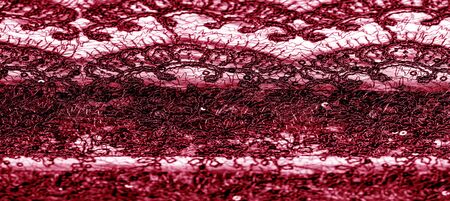 Texture, pattern, lace fabric in red on a white background. Delicate and classic, this sheer lace has no significant stretch and pearlescent shine. Suitable for your design wallpapers and postersの写真素材