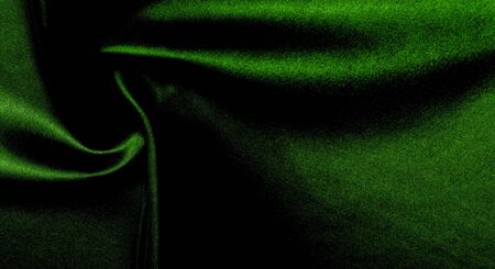 texture, background, pattern. green silk fabric panoramic photo. Silk Duke mood Satin is a beautiful and royal silk fabric. It has a shimmering shine,の写真素材