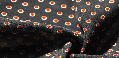 Texture background, pattern,  black silk fabric with red polka dots. Light and silky-soft satin charm is ideal for your design, Internet projects. It is also perfect for screensavers and wallpapers.の写真素材