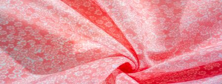 Texture, background, pattern, pink silk fabric on a white background, small flowers pattern...