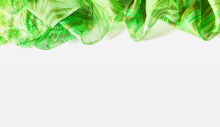 Background texture, pattern. Silk from a greenish emerald shade. This luxurious silk chiffon fabric is a show-stopper. It is clean, has a liquid drape and ultra soft. It is perfect for your design.の写真素材