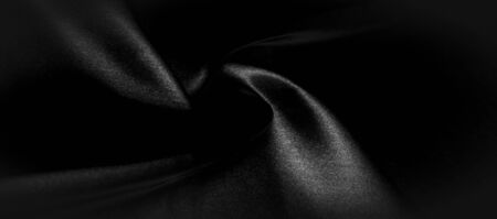 texture, background, pattern. Black silk fabric. It is black and heat resistant with gray. Transform its tougher drape into a design for any event. It is a crispy, lightly textured hand.の写真素材