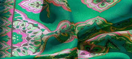 texture, background, multicolored silk fabric with a pattern of patterns on a green background,...