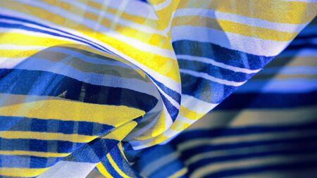 Background texture. multicolored striped silk fabric. Mexican coloring theme bright colored striped...
