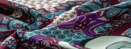Background texture. cotton women scarf black and white pattern on one side of the scarf and color...