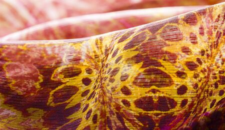 Background texture pattern Red maroon fabric. This is a collection of fine silk fibers This is a special occasion for your designs wallpapers and posters Colors include black yellow pink and burgundyの写真素材