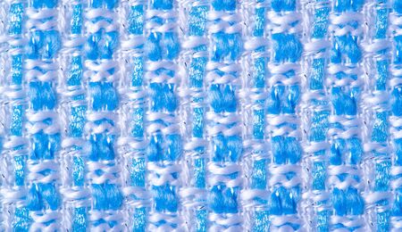 Texture, fabric, pattern. Large weave of blue and white threads, tightly woven fabric with a very...