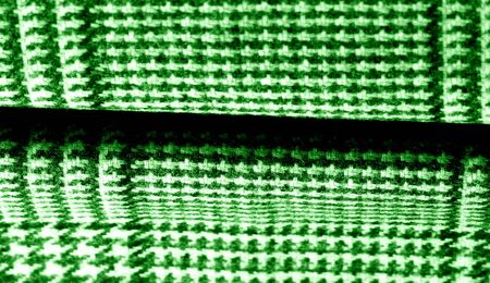 Background texture pattern. The fabric is thick, warm with a checkered pattern green This soft...
