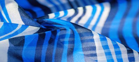 Background texture. multicolored striped silk fabric. Mexican coloring theme bright colored striped pattern with abstract stripesの写真素材