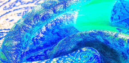 Texture background, pattern. blue brocade fabric. Organza brocade fabric - shepherd, with a crunchy...