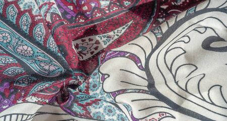 Background texture. cotton women scarf black and white pattern on one side of the scarf and color...
