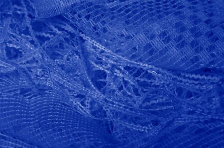 Texture, background blue tulle. Add volume, talent or detailed design details to an accessory using this phenomenal nylon tulle! If soft tulle meets your design requirements, check out other patternsの写真素材