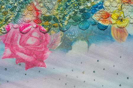 background texture; pattern. Cloth with glued lace stripes. Multicolored lace with sparkles; cording and metallic embroidery. Beautiful traditional lace for designの写真素材